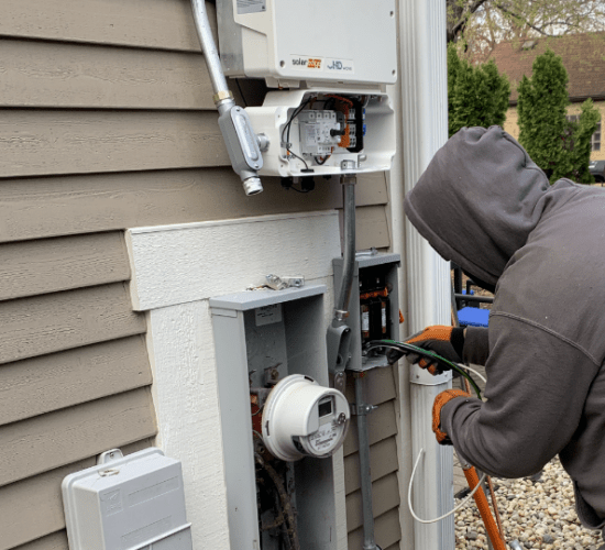Electrician wiring in a SolarEdge inverter 
